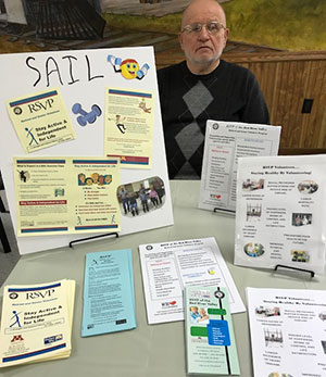 Volunteer promoting the SAIL program
