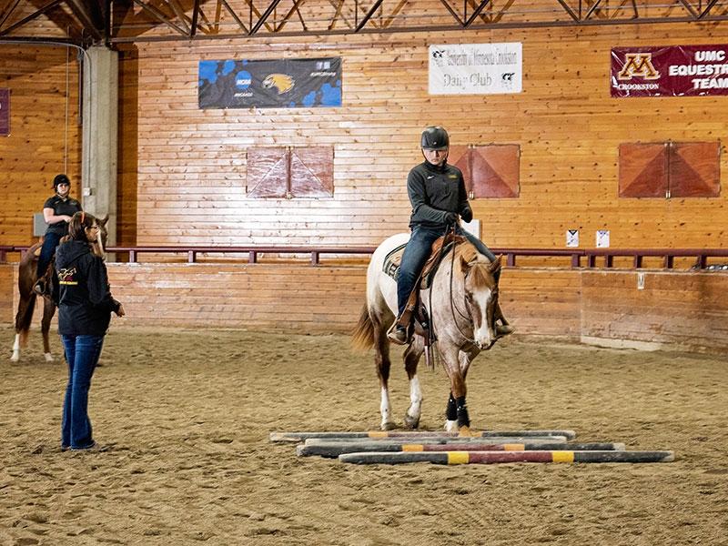UMN Crookston Equestrian team in the Charles H Casey Equine Arena