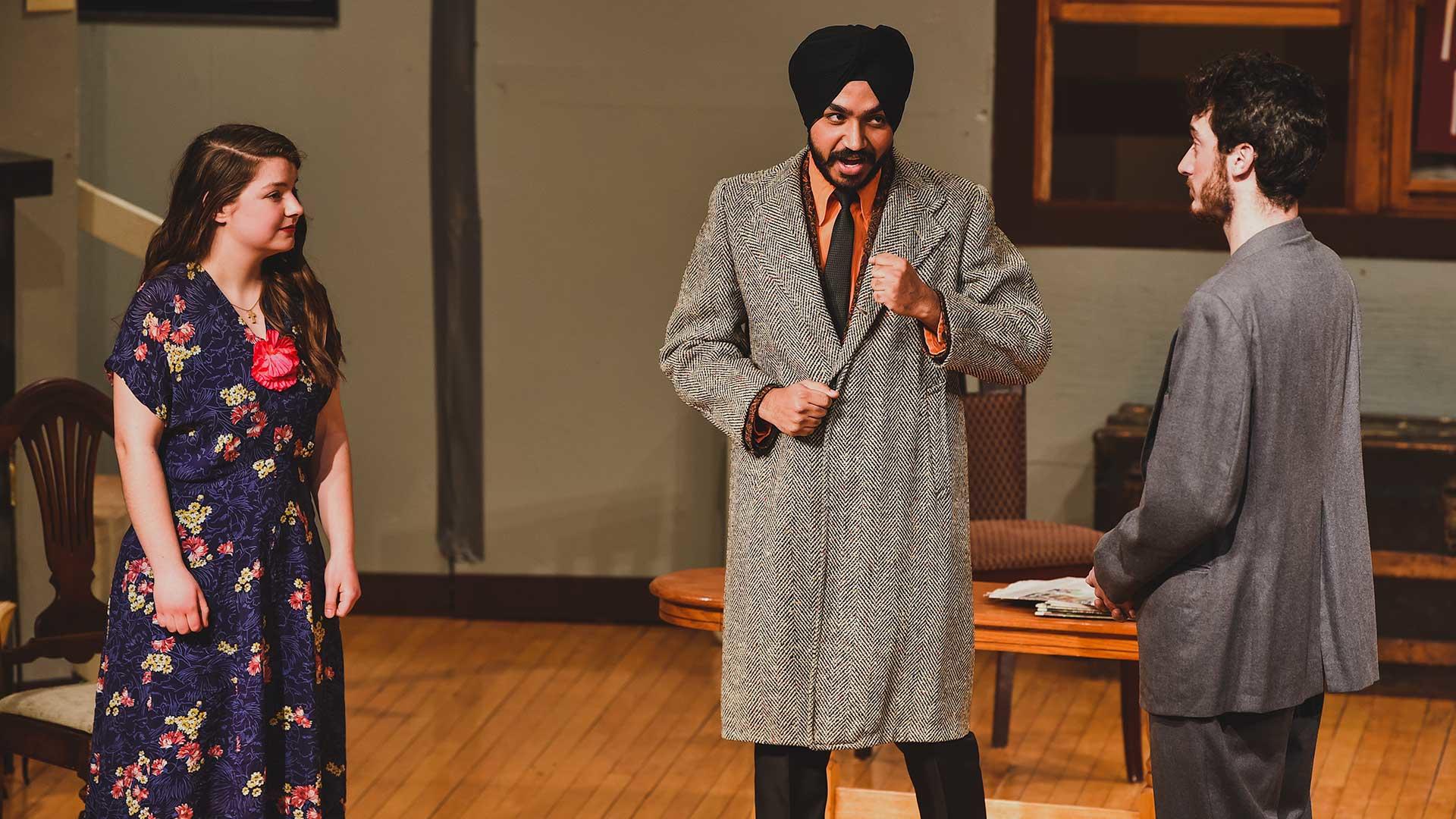 Students performing in a play in Kiehle Auditorium